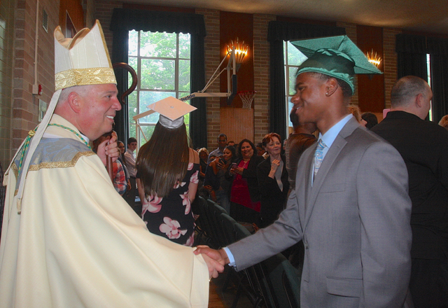 Auxiliary Bishop Nelson Perez congratulated the seniors after the Graduation Liturgy. (Credit: Barbaraellen Koch)