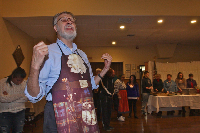 LICOC executive director Rev. Tom Goodhue delivers the blessing before the meal Tuesday evening at Polish Hall.