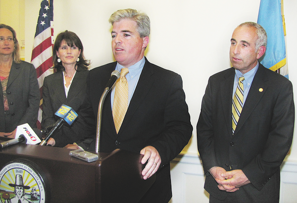 Suffolk County Executive Steve Bellone, center, Legislator Jay Schneiderman. (Credit: Tim Gannon, file)