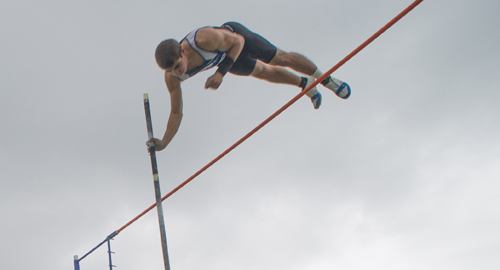 Charles Villa soars over the bar in the pole vault Friday. (Credit: Robert O'Rourk)