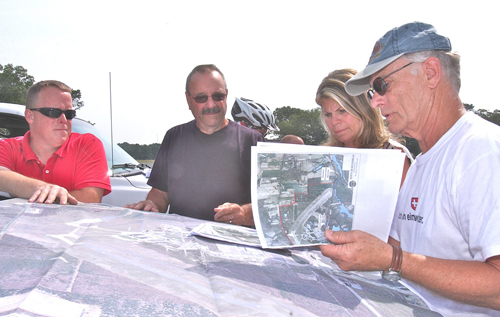 BARBARAELLEN KOCH PHOTO | Town officials including Councilwoman Jodi Giglio review bike path plans with former councilman George Bartunek, who initiated the plan to encircle EPCAL with a bike path.