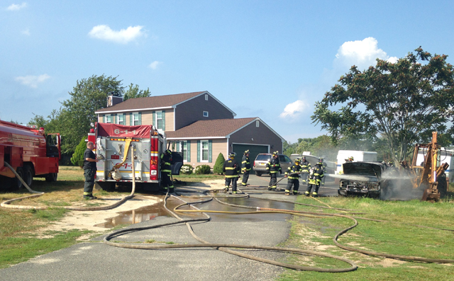 Jamesport firefighters put out a vehicle fire Tuesday afternoon. (Credit: Nicole Smith)