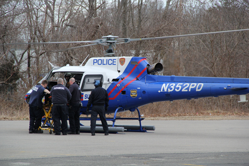 CARRIE MILLER PHOTO | Medical workers load a dirt bike crash victim into a Medevac helicopter Thursday afternoon.