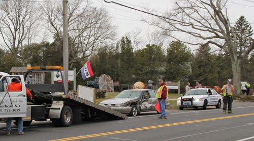 The female driver of a tan Oldsmobile was arrested after swerving into the westbound lane on Main Road in Jamesport.  (Credit: Carrie Miller) 