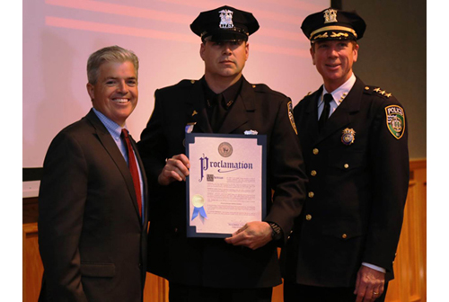 Suffolk County Executive Steve Bellone, Riverhead Police Officer Timothy Murphy and Chief David Hegermiller (Credit: Courtesy photo)