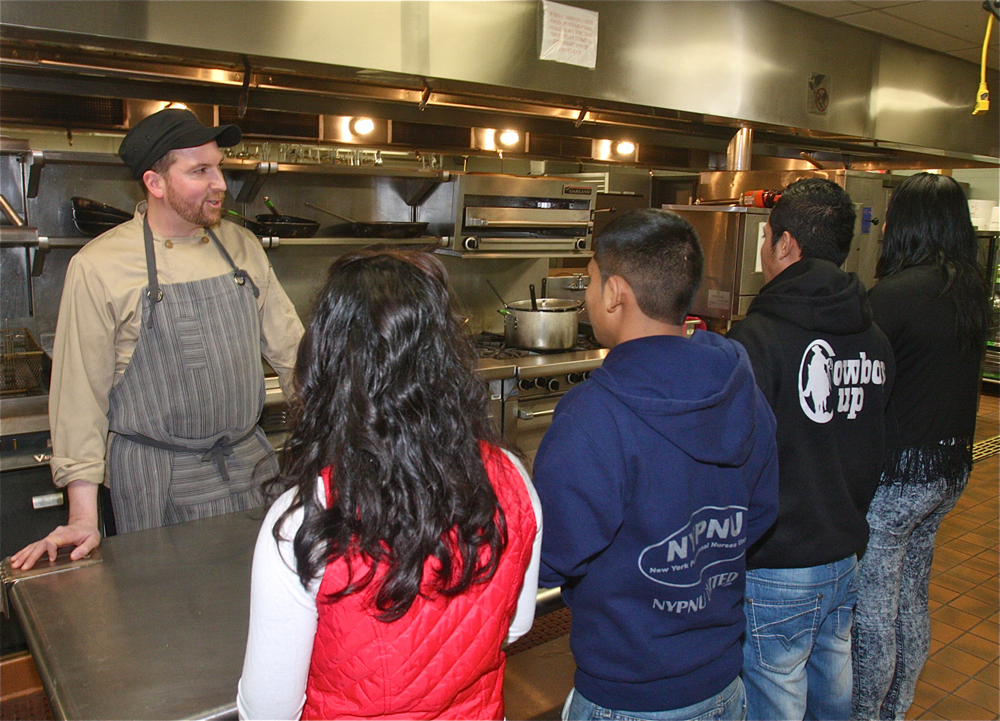 Culinary instructor Eric Rickmers talk to the new students in the commercial kitchen Monday afternoon. (Credit: Barbaraellen Koch)