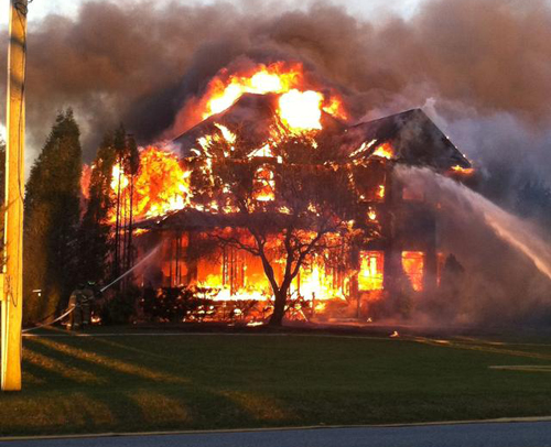 COURTESY PHOTO | Four fire departments battled this fire on Twomey Avenue late Sunday afternoon.
