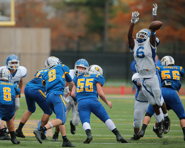 Riverhead's Tyrese Kerr blocks a pass from West Islip's Conor Smith in the third quarter. (Credit: Daniel De Mato)