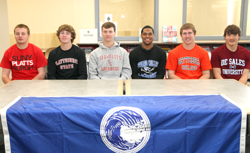 Six Riverhead athletes will continue playing their sports in college next year. At a signing ceremony Tuesday, (from left) Mike Van Bommel, Ryan Hubbard, Daniel Czelatka, Jaron Greenidge, Ryan Harkin and Tim Vail were honored. (Credit: Riverhead School District)