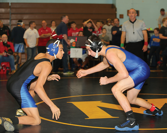 Riverhead senior Ed Matyka (right), pictured at the North Fork Invitational last year, is second-ranked in the county this season at 120. (Credit: Daniel De Mato, file)