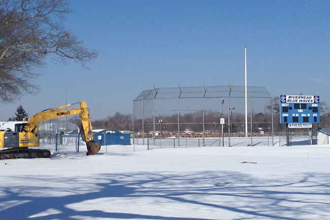 The rough winter left McKillop Field covered in snow, which has finally begun to melt, delaying the sod installation as the field undergoes renovations. (Credit: Joe Werkmeister)