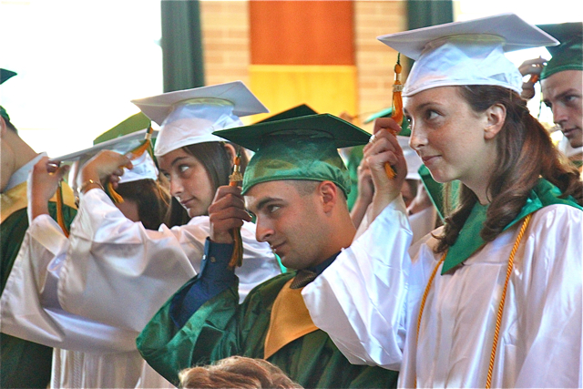 Mercy graduates move their tassels during Thursday's commencement ceremony in Riverhead. (Credit: Robin Bay)