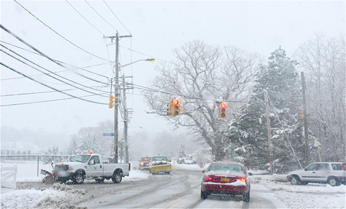 Riverhead Town plows on Middle Road Monday afternoon. (Barbaraellen Koch Photo) 