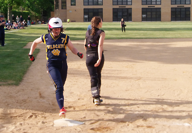 Shoreham-Wading River senior Caitlin Mirabell crosses home plate after hitting a home run in the sixth inning Friday. (Credit: Joe Werkmeister)