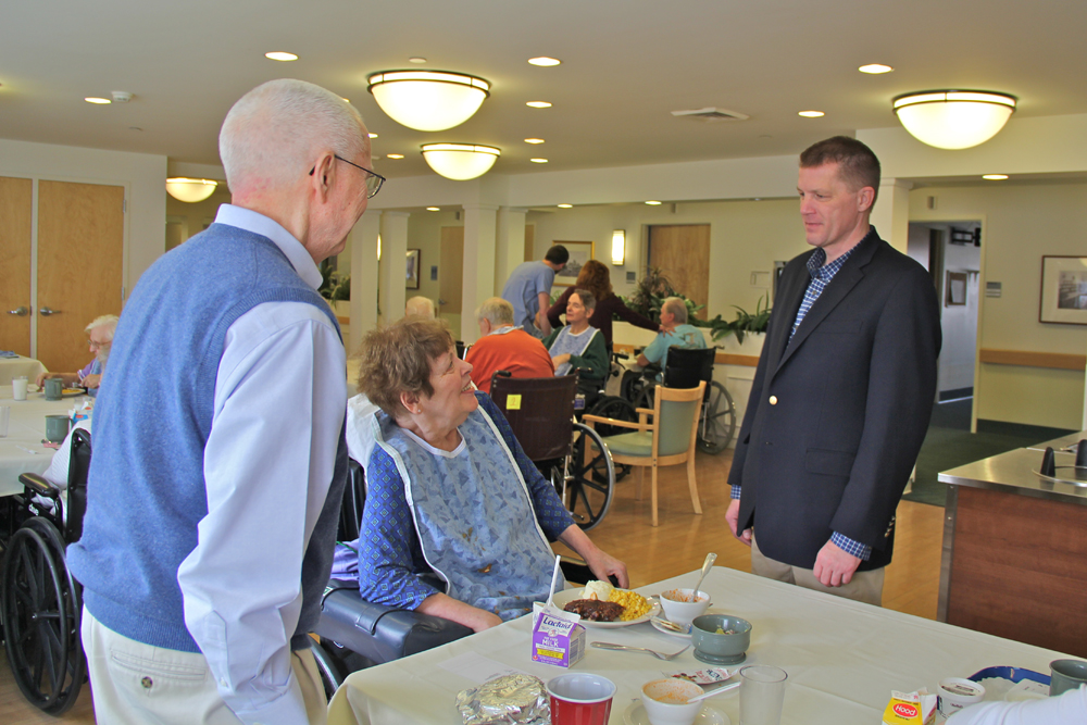 Supervisor Scott Russell (right) speaks with San Simeon resident Barbara Yagle, 75, and her husband Jim, 79 of Cutchogue, who stopped to have lunch with his wife. 
