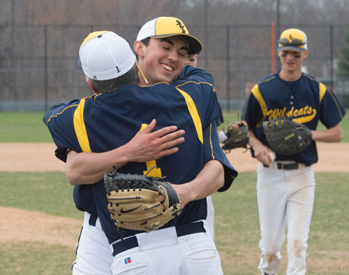 Shoreham-Wading River freshman Brian Morrell embraces coach Sal Mignano after throwing a no-hitter Friday against Mount Sinai. (Credit: Robert O'Rourk)