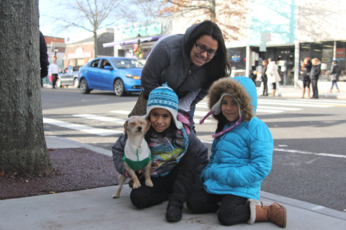 Daniela Perez of Riverhead with daughters Tiffany, left, and Michelle. Their pet Buddy tagged along to watch the parade.