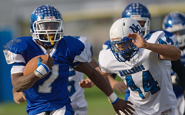 Riverhead running back Ryun Moore leads the Blue Waves' rushing attack this season. (Credit: Garret Meade, file)