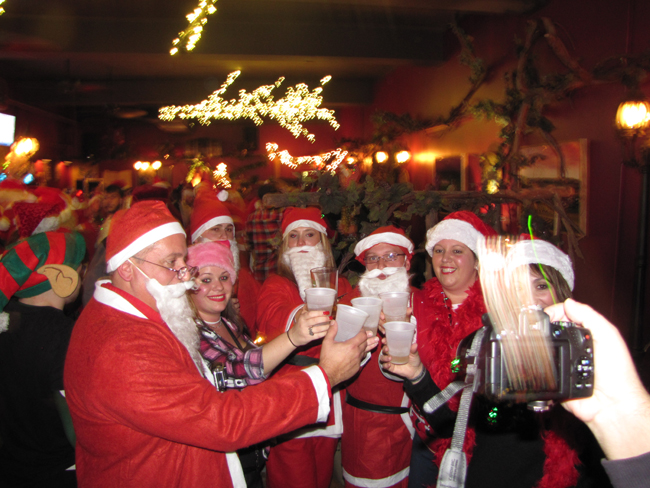 Santa was everywhere Saturday night in Riverhead for Santacon. (Credit: Paul Squire)