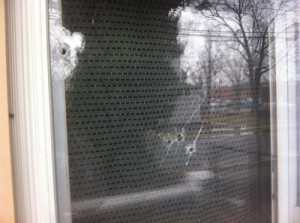 CARRIE MILLER PHOTO | Several bullets pierced the windows, though no one was hurt.