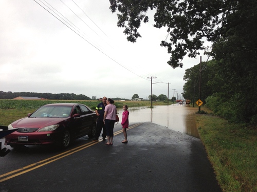 A car was pulled out of a flooded Sound Avenue this morning. (Credit: Paul Squire)