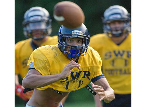 Shoreham-Wading River senior Isreal Squires during a practice leading up to yesterday's season opener. (Credit: Garret Meade)