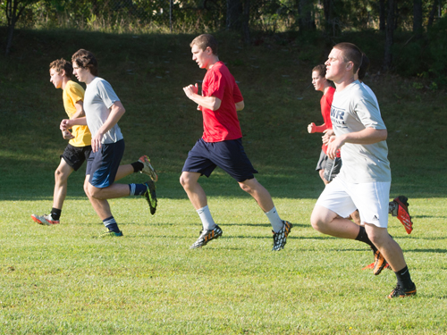 Players on the Shoreham-Wading River soccer team run sprints during tryouts last week. (Credit: Robert O'Rourk)