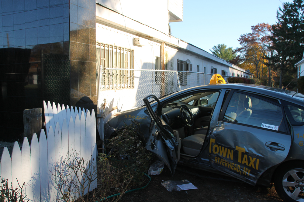 The taxi driver was taken to Peconic Bay Medical Center with a head injury. (Credit: Michael White)
