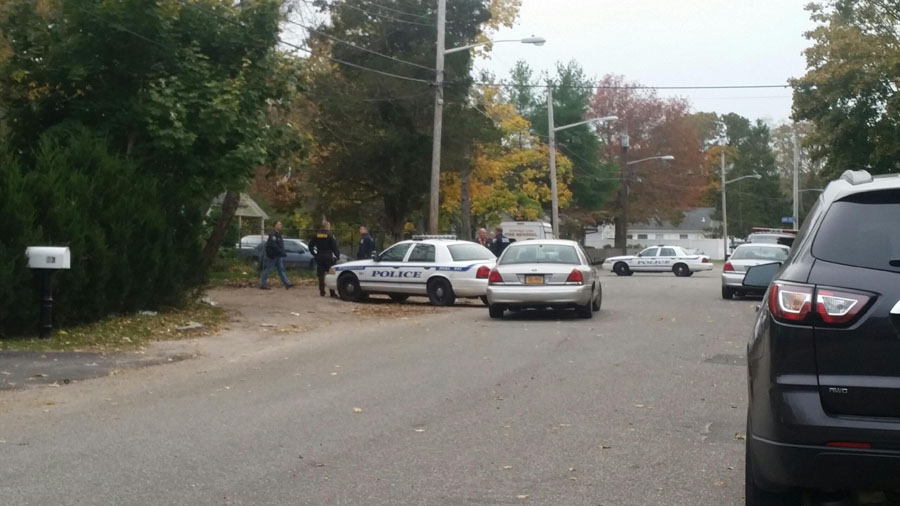 Several agencies helped with the search warrant execution on Lewis Street in Riverhead. (Credit: Carrie Miller)